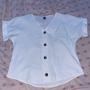 White tee shirt with decorative buttons